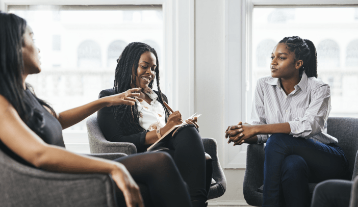 Happy businesswomen having a meeting in the office