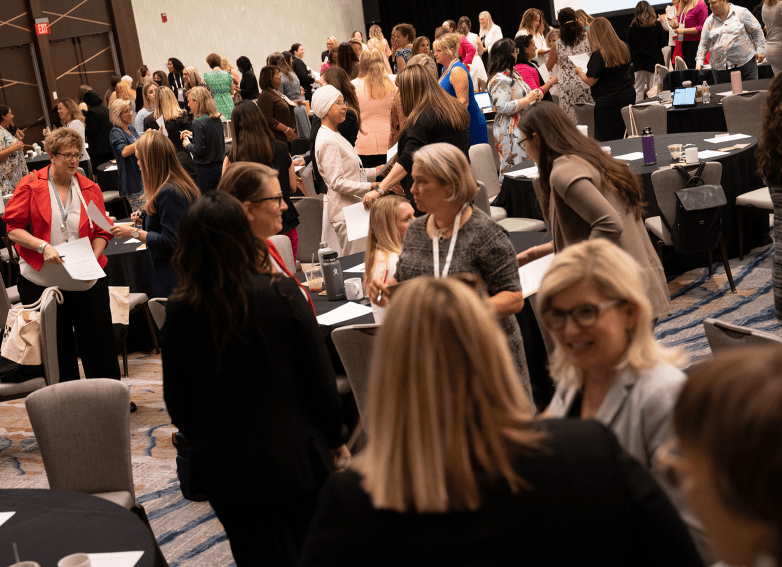 Members networking at a leadership summit