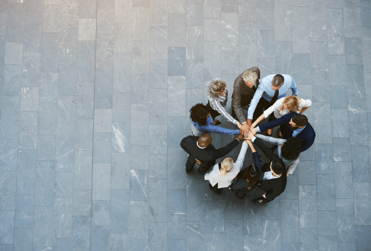 diverse group business people hands in together circle