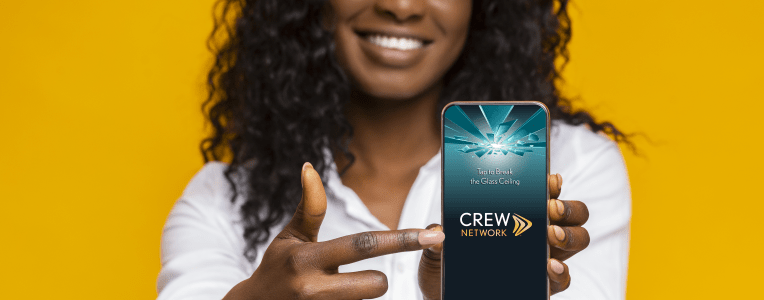 Cool mobile app. Cheerful african american girl pointing on blank screen of smartphone, empty space