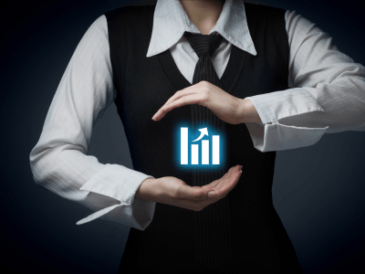 businesswoman's hands encircling digital productivity bar chart