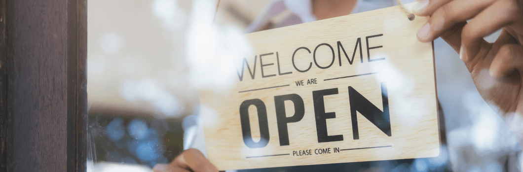 Young startup coffee cafe owener open and welcome customer. New small business owener.